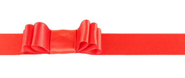 Rött band och röd rosett — Stockfoto