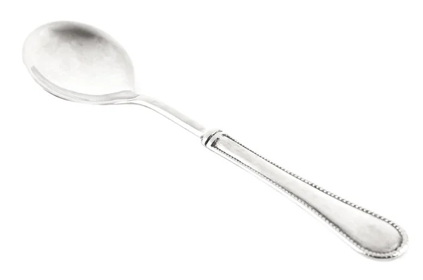 Metal teaspoon on white — Stock Photo, Image