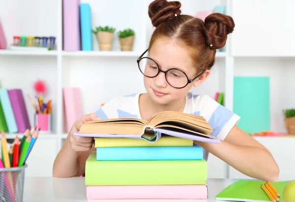 Cute girl at workplace in classroom — Stock Photo, Image