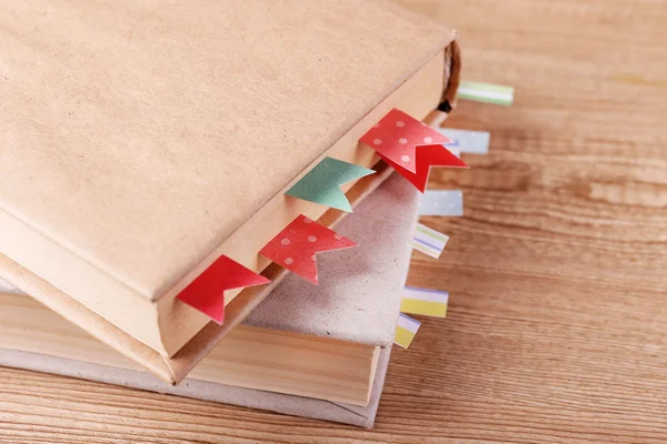 Books with bookmarks on table — Stock Photo, Image