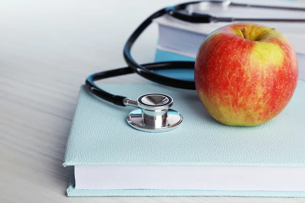 Medical stethoscope with books — Stock Photo, Image