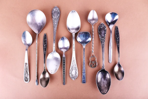 Metal spoons on paper — Stock Photo, Image