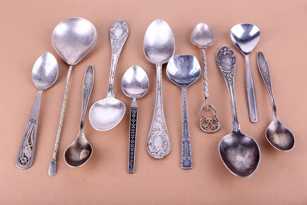 Metal spoons on paper — Stock Photo, Image