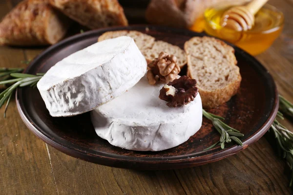 Camembert cheese on plate — Stock Photo, Image