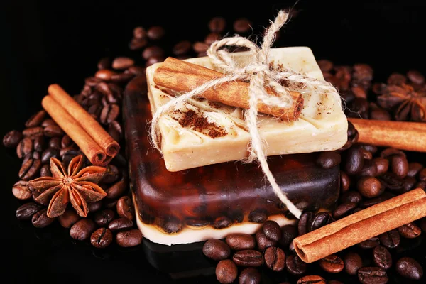 Organic soap with coffee beans and spices, on dark background — Stock Photo, Image