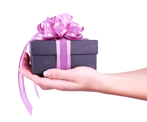 Woman's hand holding gift box isolated on white — Stock Photo, Image