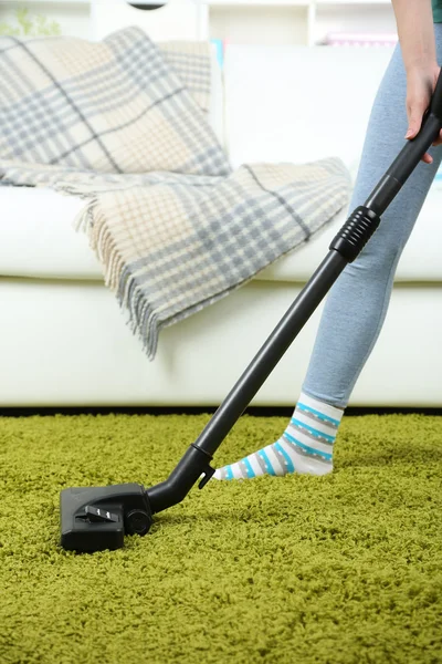 Girl vacuuming in room — Stock Photo, Image