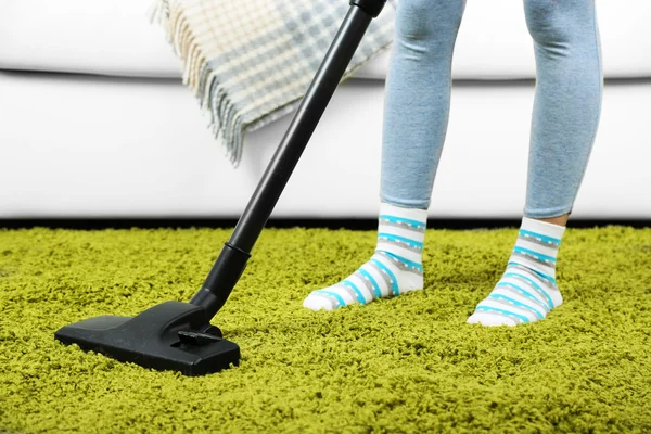 Girl vacuuming in room — Stock Photo, Image