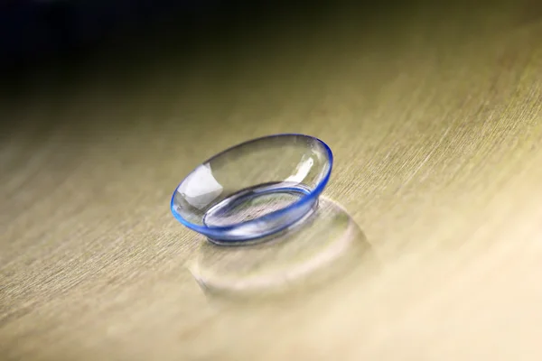 Contact lens on color background — Stock Photo, Image