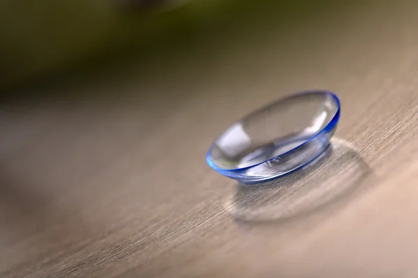 Contact lens on color background — Stock Photo, Image