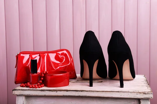 Black women shoes and beautician on wooden background — Stock Photo, Image