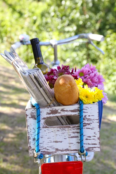 Bicycle with flowers and bottle of wine — Stock Photo, Image