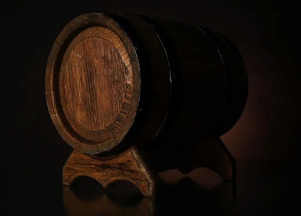 Barrel on wooden table on dark background — Stock Photo, Image