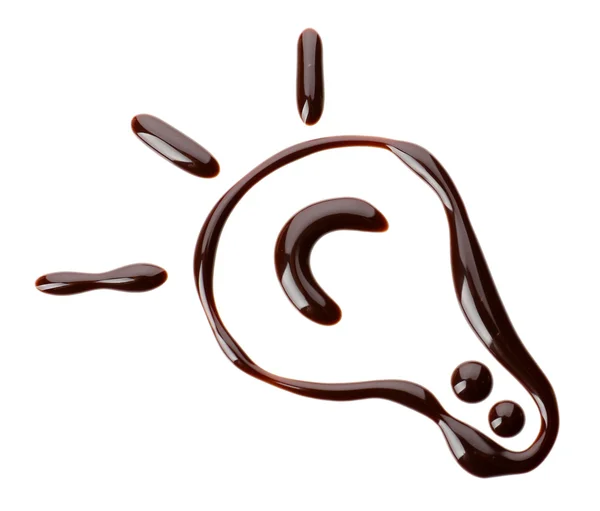 Chocolade siroop druppels in vorm van gloeilamp geïsoleerd op wit — Stockfoto