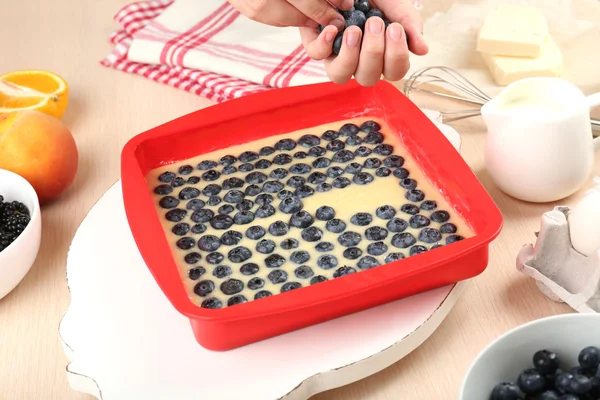 Baking tasty pie and ingredients for it on table in kitchen — Stock Photo, Image