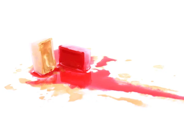 Watercolor paint cube and spilled paint isolated on white — Stock Photo, Image