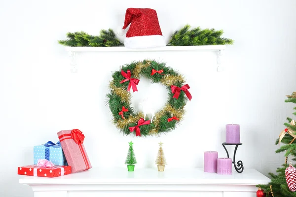 Fireplace with beautiful Christmas decorations in room — Stock Photo, Image