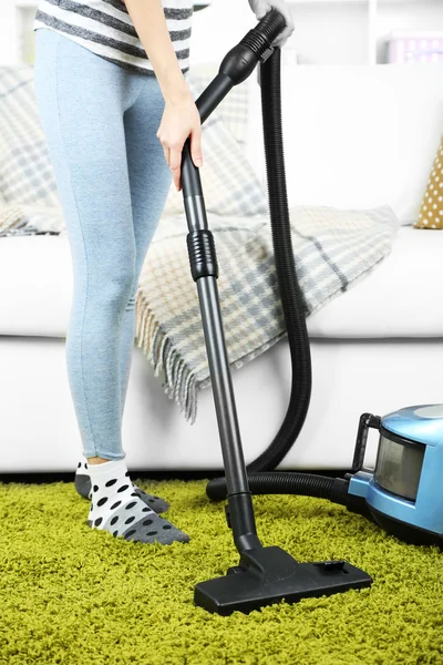 Girl vacuuming in room — Stock Photo, Image