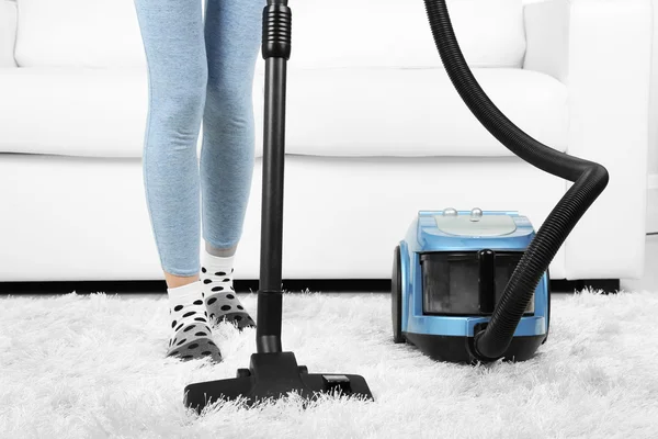 Girl vacuuming in room — Stock Photo, Image