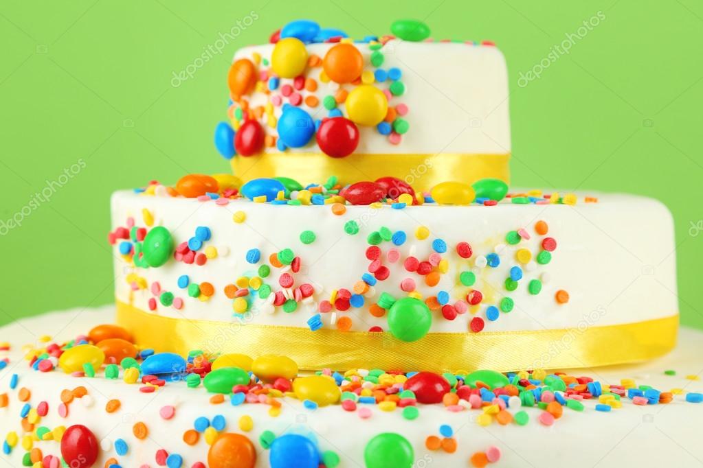 Beautiful tasty birthday cake on color background