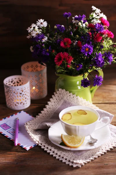 Still life of beautiful flowers in vase on wooden background — Stock Photo, Image