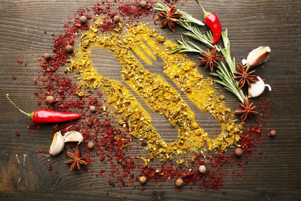 Kryddor på bordet med bestick silhouette, närbild — Stockfoto