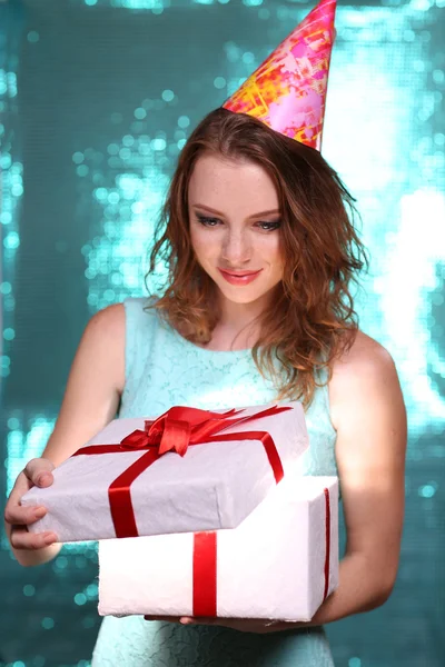 Portrait of beautiful young girl on bright blue background — Stock Photo, Image