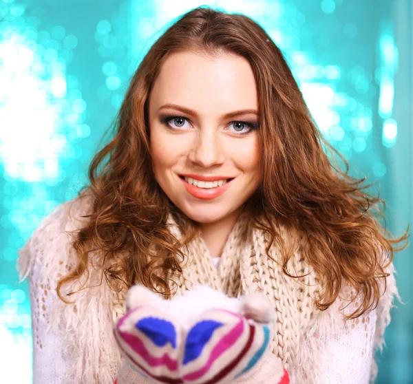 Portrait of woman in scarf and gloves on bright blue background — Stock Photo, Image