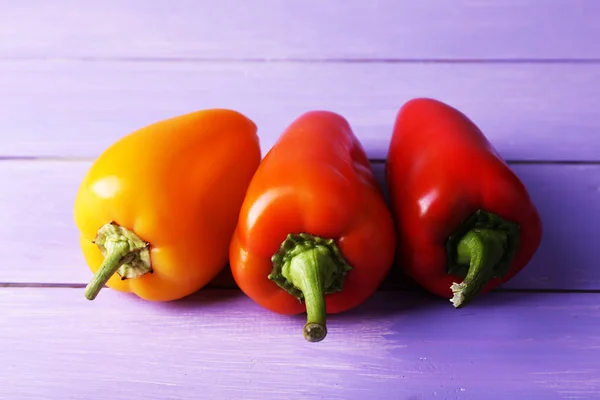 Pepper on wooden background — Stock Photo, Image