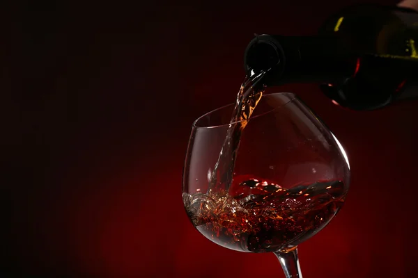 Wine pouring into wine glass — Stock Photo, Image