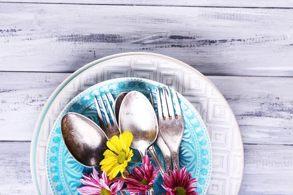 Plates and vintage cutlery — Stock Photo, Image
