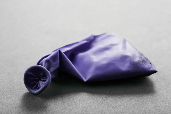 Popped violet balloon — Stock Photo, Image