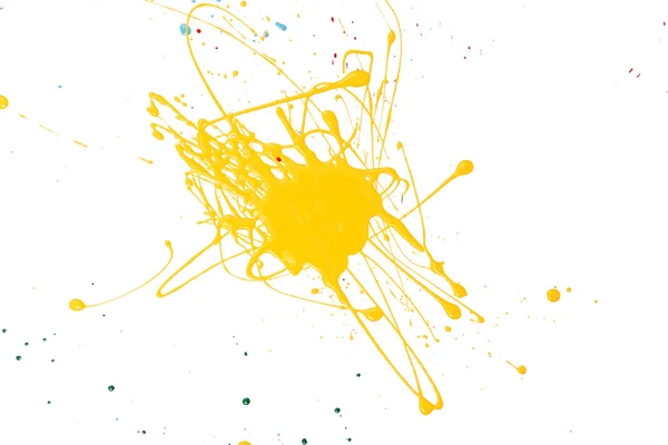 Salpicadura de pintura amarilla aislada en blanco —  Fotos de Stock
