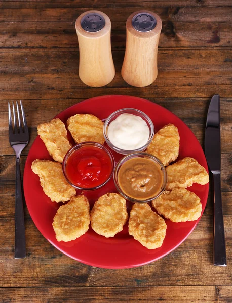 Chicken nuggets with sauces on table close-up — Stock Photo, Image