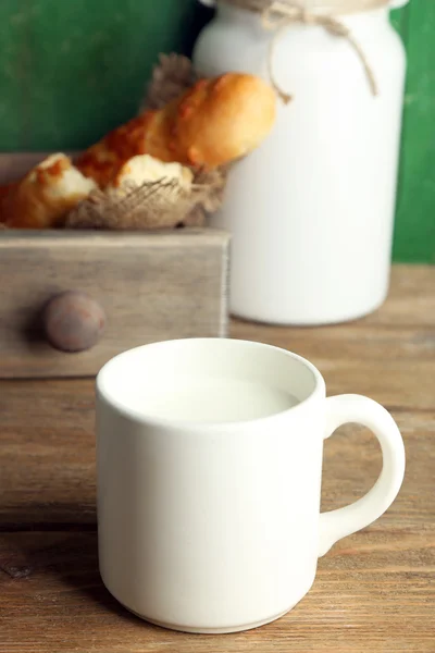 Retro still life with tasty rustic milk, on wooden table — Stock Photo, Image