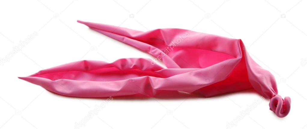 Popped pink balloon isolated on white