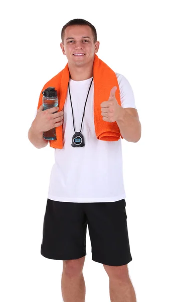 Handsome young sportsman holding towel and bottle with water isolated on white — Stock Photo, Image