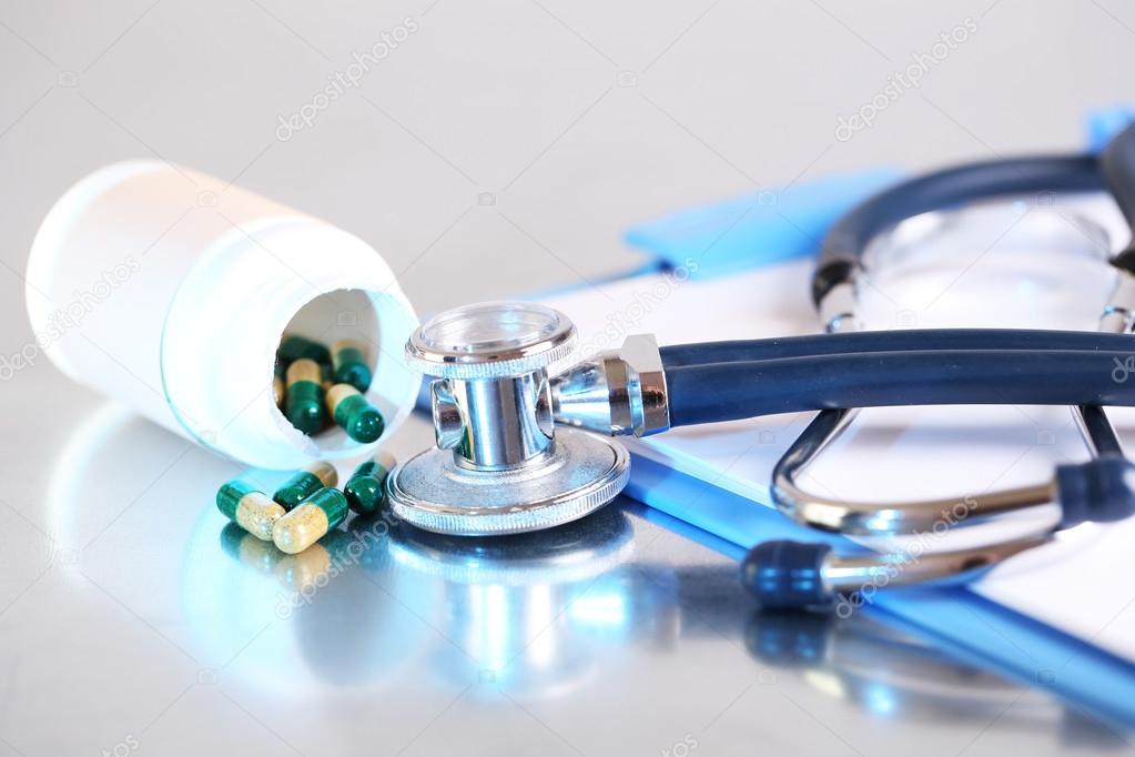 Stethoscope with pills and bottles