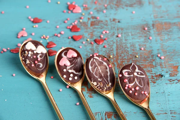 Spoons with tasty chocolate — Stock Photo, Image