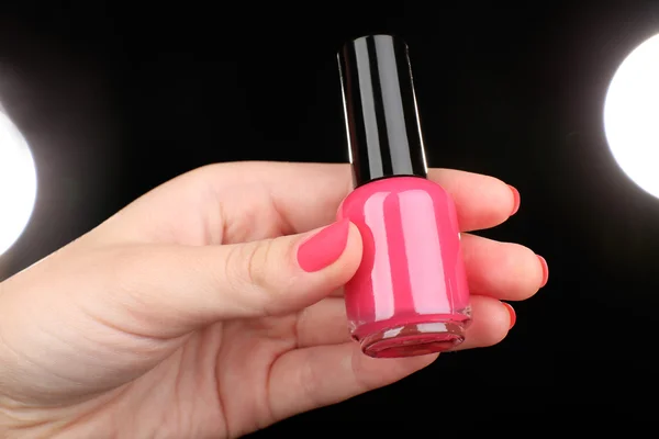 Nail polish in hand — Stock Photo, Image