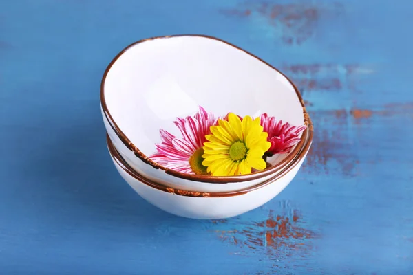 Bowl on color wooden background — Stock Photo, Image