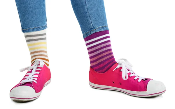 Legs in colorful socks and sneakers — Stock Photo, Image