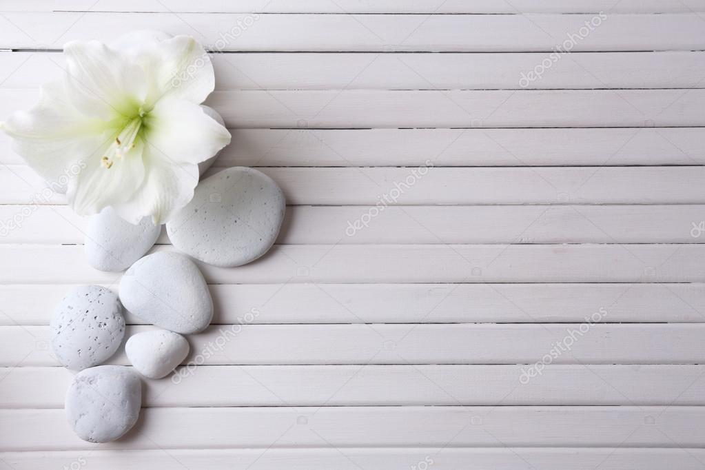 Spa stones on wooden table