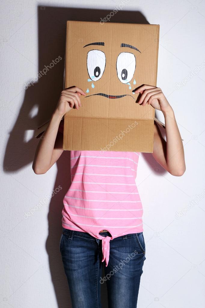 Woman with cardboard box on her head — Stock Photo © belchonock 56109981