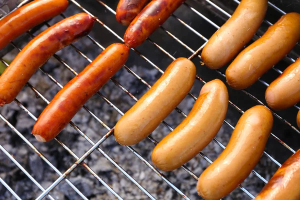 Sausages on barbecue grill — Stock Photo, Image