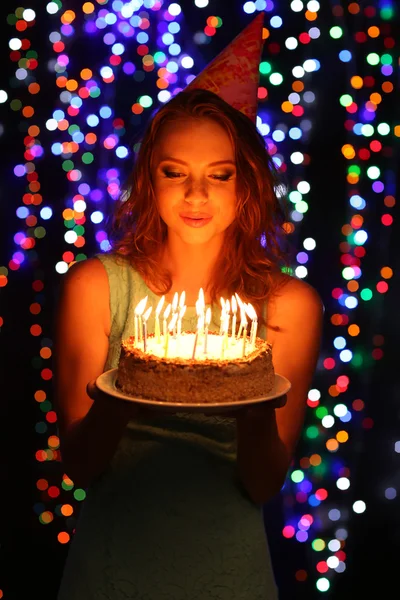 Portrait of beautiful young girl on bright lights background — Stock Photo, Image