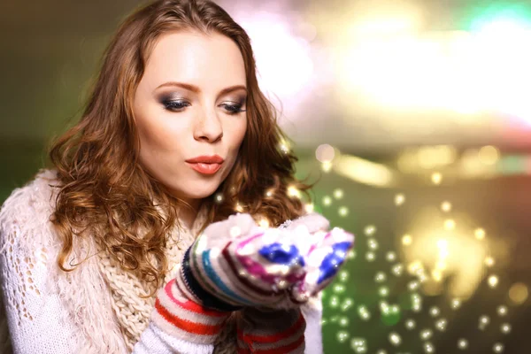 Portrait of woman in scarf and gloves on bright background — Stock Photo, Image
