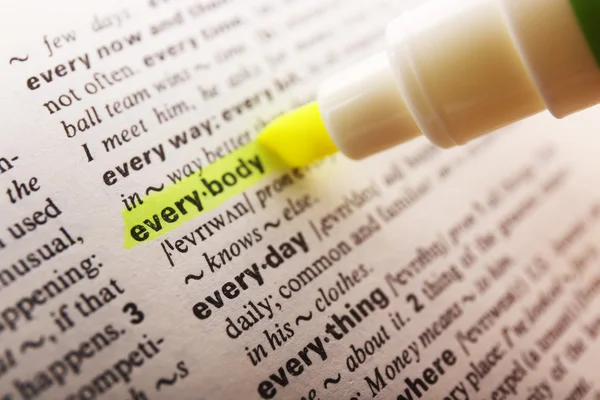 Yellow marker highlighting word in dictionary — Stock Photo, Image