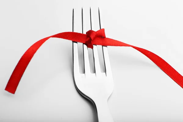 Stages with tying bow on fork Stock Picture