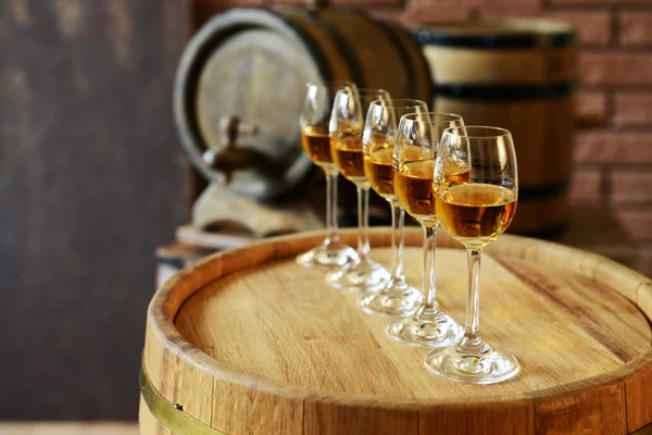 Glasses of wine in cellar — Stock Photo, Image